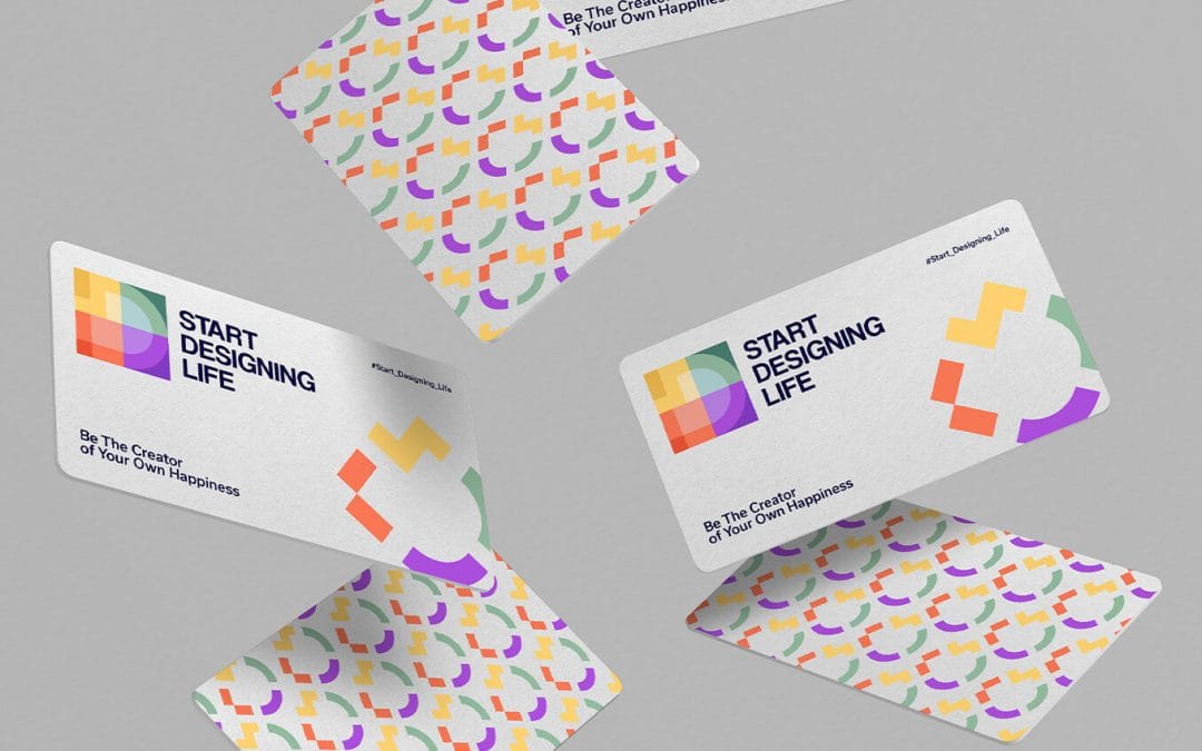 A set of colorful business cards that are flying in the air.